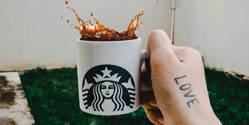 Is it safe to reheat Starbucks coffee, or are there potential risks involved in doing so?