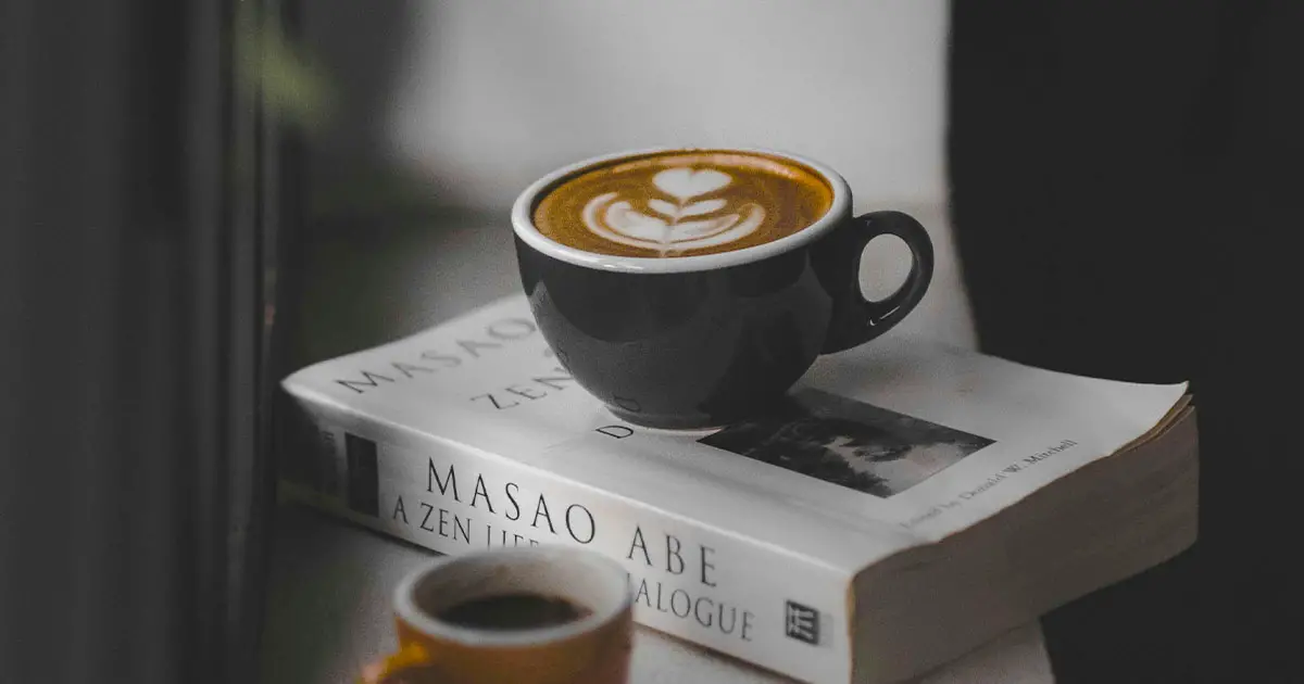 a coffee cup on a book